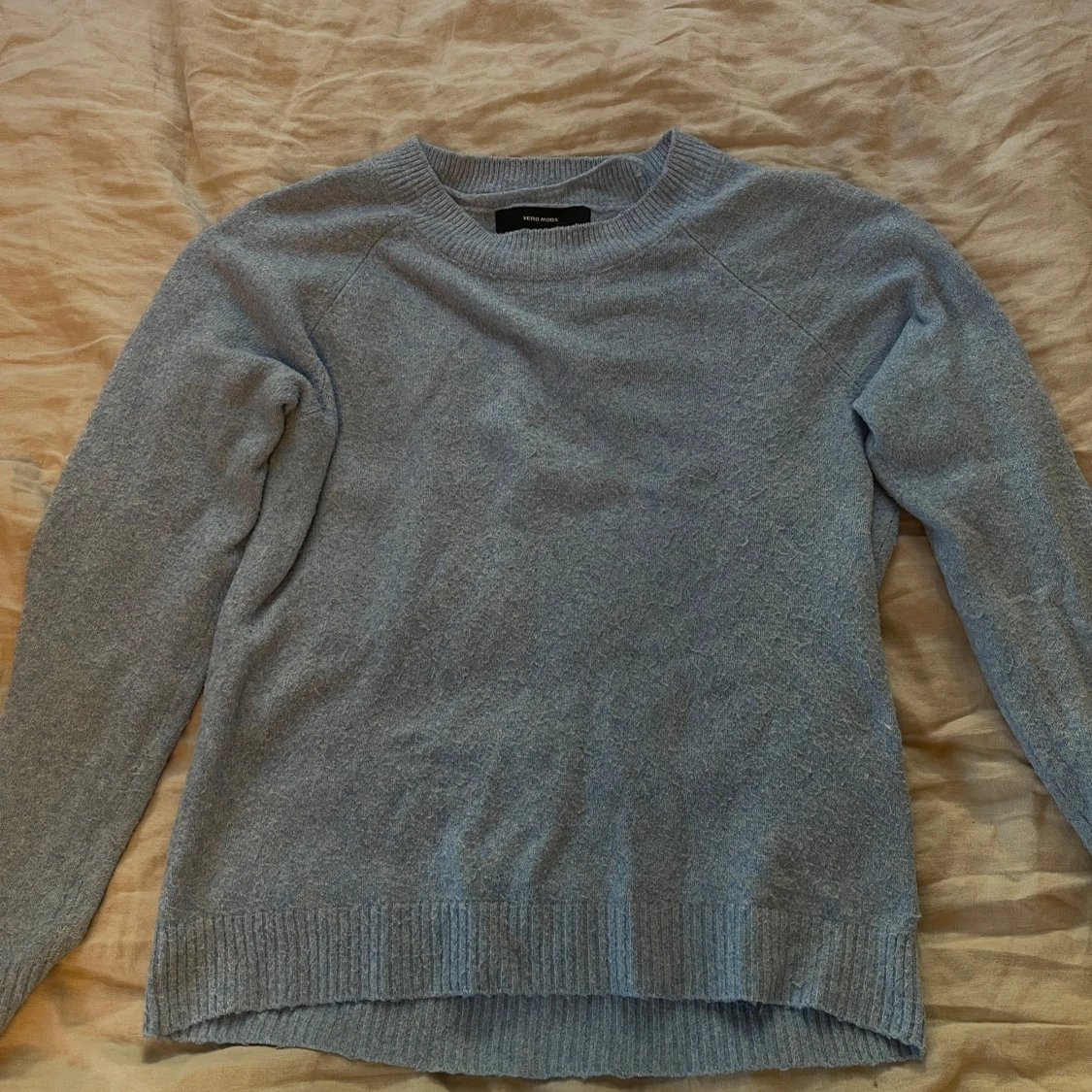 Ljusblå stickad tröja