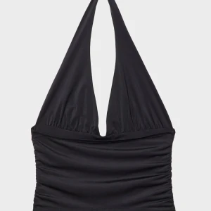 Svart halterneck topp - Snygg svart halterneck topp med djup v-ringning. Perfekt för en stilren look, passar både till jeans och kjol. Tillverkad i ett mjukt och stretchigt material för en bekväm passform.