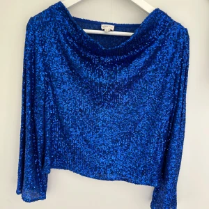 Glitter topp - Glittteig topp med boat neck, vida ärmar