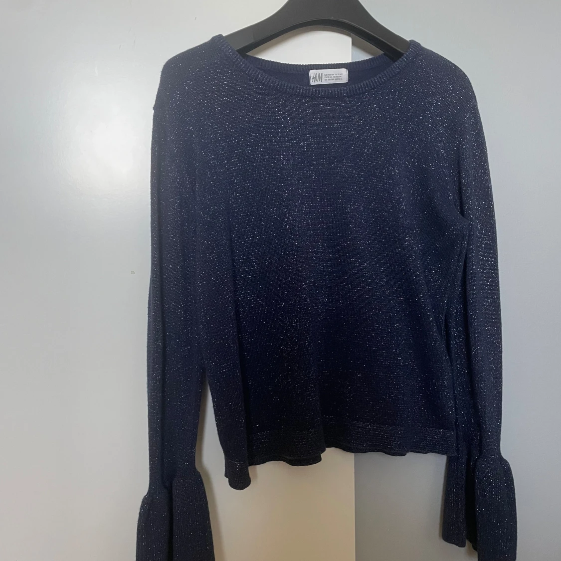 Glittrig långärmad blus