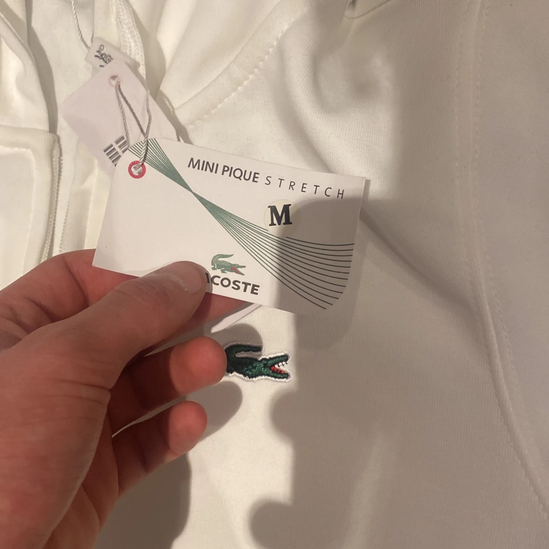 Vit hoodie från Lacoste - 90