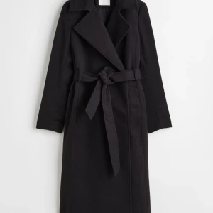 Kappa - En svart klassisk kappa som är använd ett antal gånger!