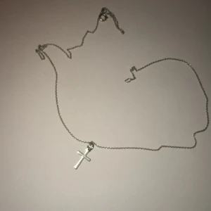 Korshalsband  - Ett korshalsband av okänd metall:)