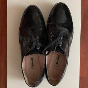 Miu Miu black glossy shoes