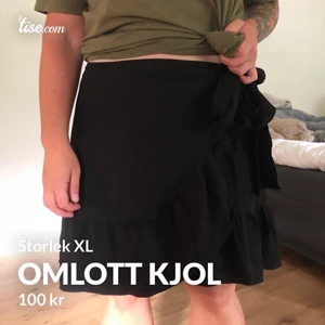 Omlott kjol - En fin omlott kjol, använd ca 1-3 gånger, inget slitage och sitter väldigt fint på en L eller XL