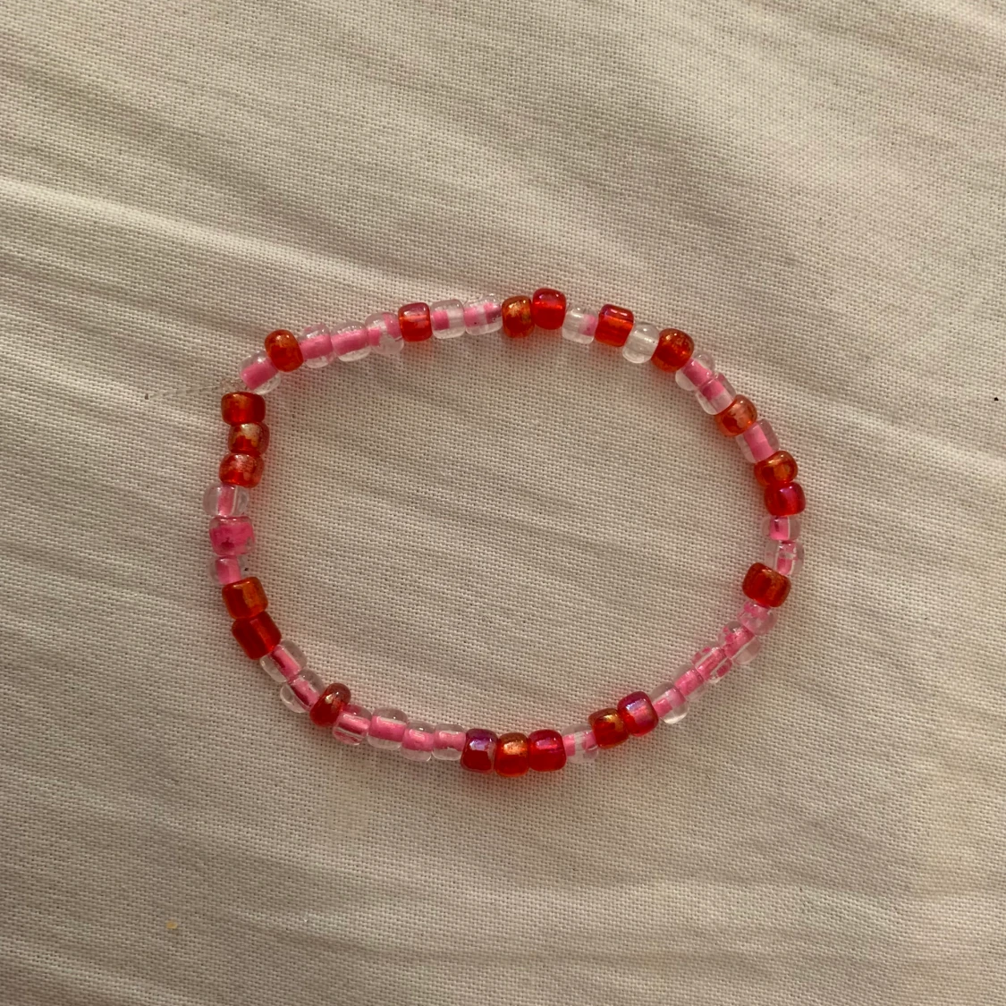 Rosa/rött armband - 91