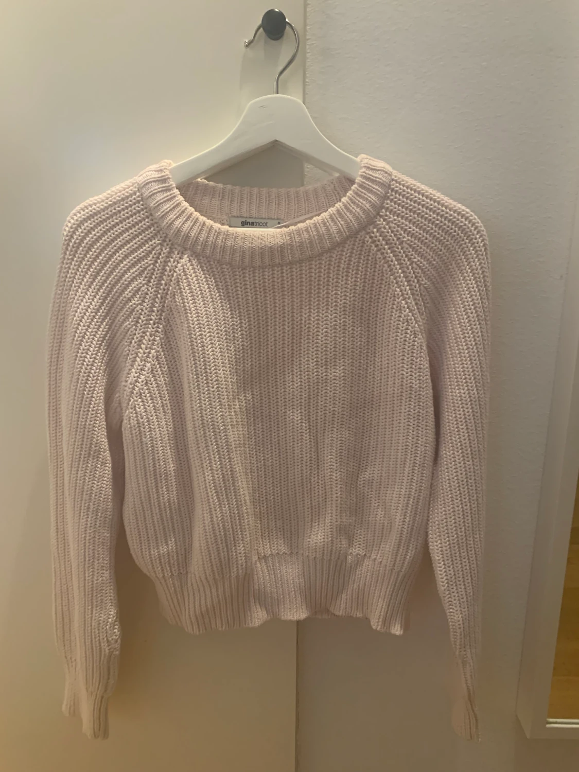 Stickad ljusrosa tröja