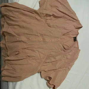 Rosa topp - LjusRosa lös topp Storlek 34  Använd 1 gång 