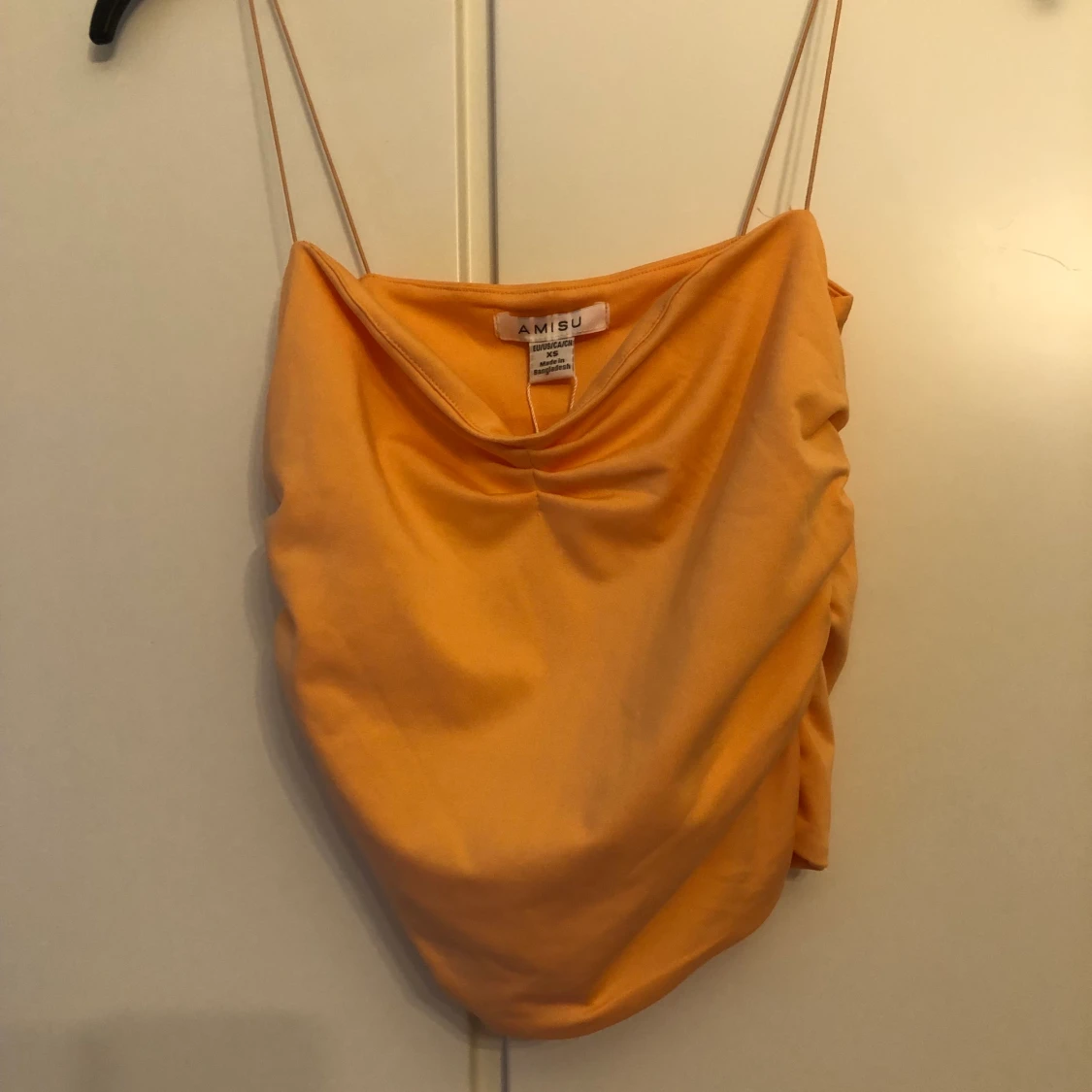 Oanvänt linne från New yorker. Fin färg i toppenskick!