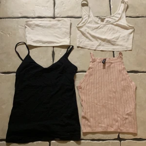 Toppar - Garderob rensning! Topparna enskilt kostar 20kr, tillsammans 70kr  Tubtoppen är köpt på Gina tricot och den vita med axelband är ifrån monki. Den svarta är ifrån lager157 och den rosa är köpt på H&M!