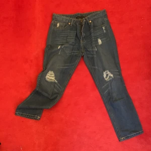 Signature jeans  - Signature jeans with a very light stripe pattern and nice opening design. It’s a go to for any day. Goes with anything. 