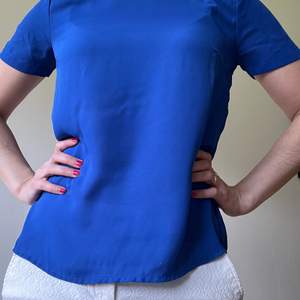 Very nice royal blue blouse, fresh material, see through, perfect to wear for the office or after work. 