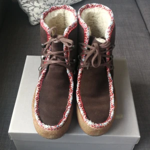 Clarks boots - Brown suede with wool lining boots. They keep your feet so warm. Very comfortable and easy slip in. From Clarks originals. 