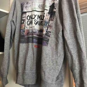 House sweatshirt which is very smooth and nice to wear. Saying “only music can save us”