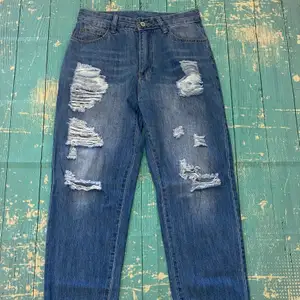 I love these jeans! So cute a little too big for me so I have to part ways. Highwaisted Baggy Style Boyfriend Jeans with distressed hem and elastic band ends. Size Medium waist is 14.38” 