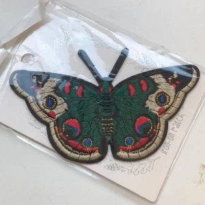 Understryknings fjäril patch - Porto 11kr.