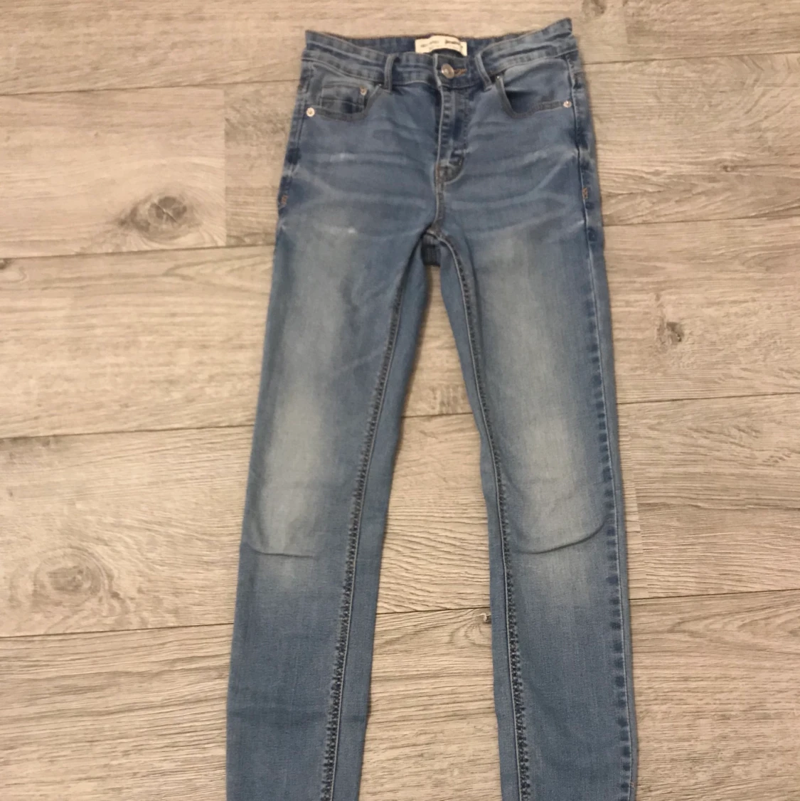 Blå högmidjade skinny jeans
