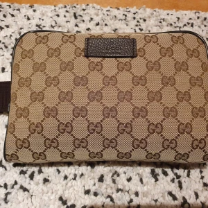 Gucci Canvas monogram belt bag - Gucci belt bag with tags, receipts and dust bag. Bought in Gucci store, in NYC. In excellent condition. 