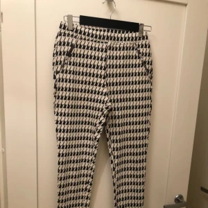  - Soft trousers with the zipper on legs and by the pockets 