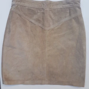  - Brun mockakjol i storlek XS