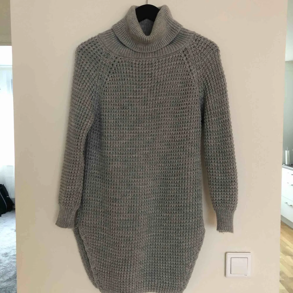 It is almost new. I wore it only two times. One time was for the picture.;) Size is more universal, could fit S,M and even L. My size is XS/S it fits perfectly. The material is wool. . Tröjor & Koftor.