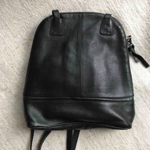  - Black soft leather mini-bag. Perfect condition. Lots of pockets. Shipping is extra.