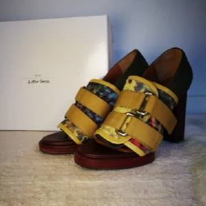  - Vey funky pair of leather heels made in Italy. They're fun and very comfortable to wear. The pair has been worn 2 times only so they're in a very good condition minus a small defect on the inner lining of the heel which is not even visible. This pair brightens up any outfit!