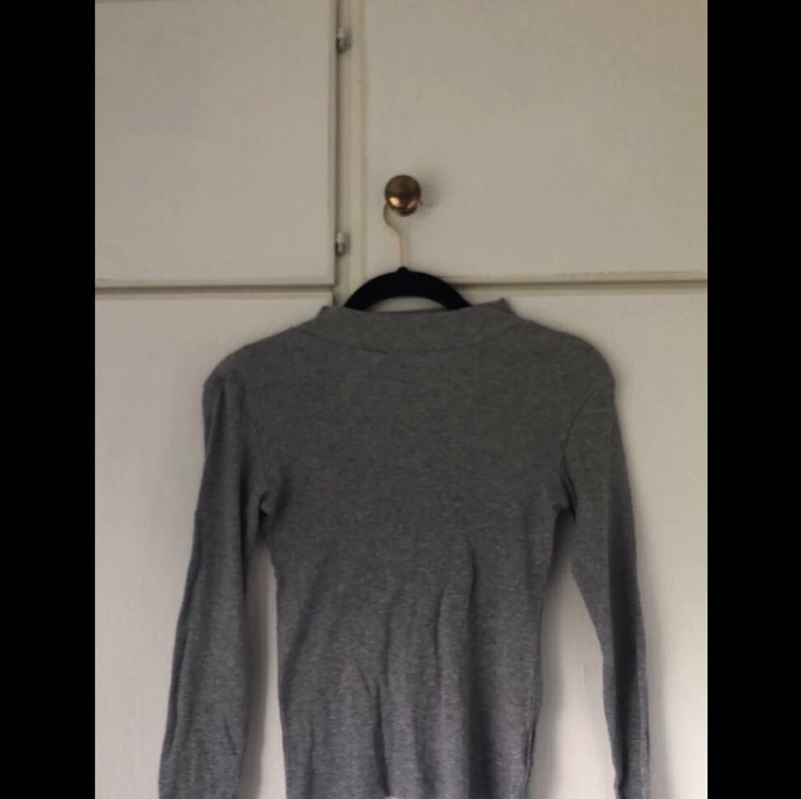 Grå polotröja storlek xs