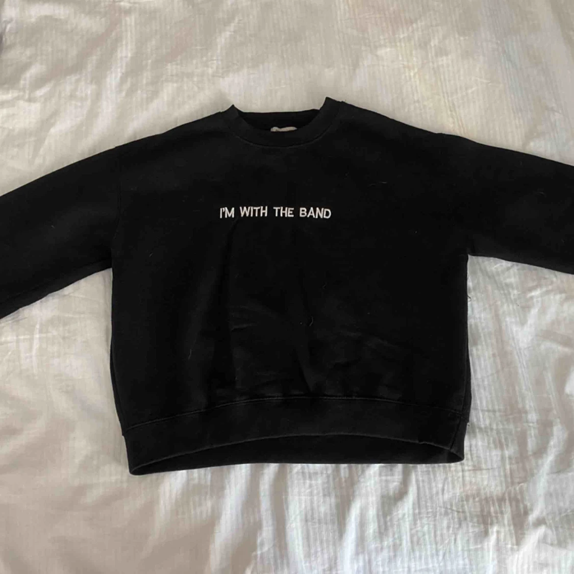 Sweatshirt med text