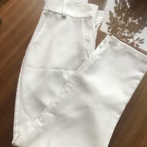 Elegant wite pants  - High waisted, could go well on a medium size as they look nice with a belt, they are totally new, I never wore them 