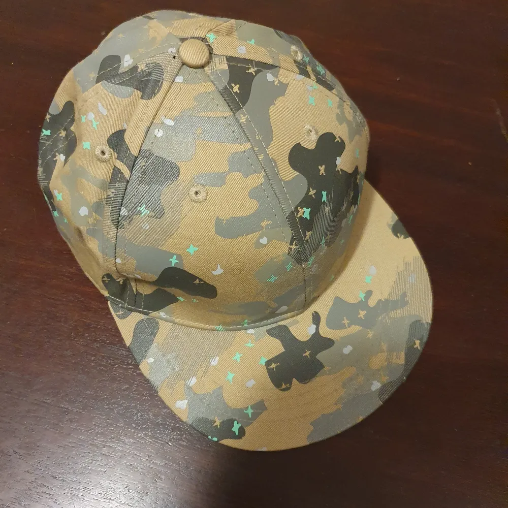 Camouflage cap, size 59. Excellent shape. Accessoarer.