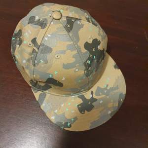 Camouflage cap, size 59. Excellent shape