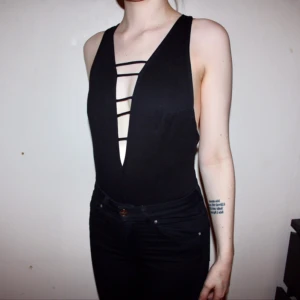  - Svart body från BIKBOK. Storlek XS. Endast använd 1 gång. Frakt kostar 30kr