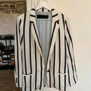 White-blue striped blazer from Zara. 