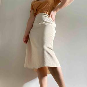 Gorgeous satin midi skirt (not see through) cream colored.