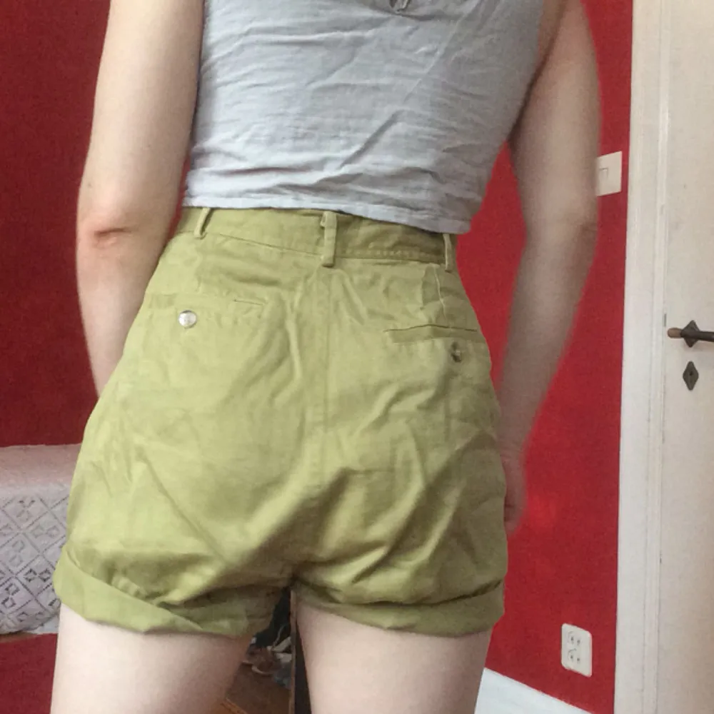 Khaki green shorts, with very high comfortable waist. . Shorts.