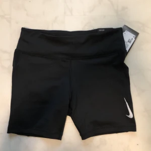 Nike Tight Fit - Nike tight fit short length, with a transparency on the sides. New, size S. Shipping included