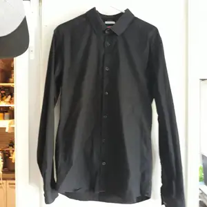 Man Black shirt Celio. Dress up shirt very good status. Have been use only few time. Size L slim fit