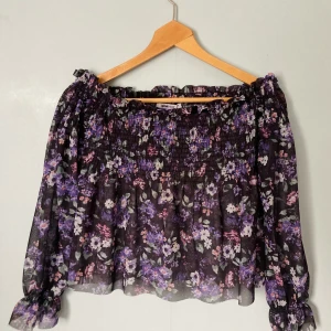 See through off shoulder blouse size XS - - Off shoulder - Size: XS - Color: black with flowers - Only used once - Recommend to wear with something under, because it’s see through 