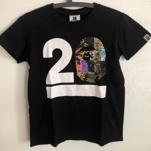 Women’s Bape 20th Anniversary Tee - Women’s Bape / A Bathing Ape 20th Anniversary T-Shirt  Size small, women’s fit.  Great condition, no flaws or damage.  DM if you need exact size measurements.   Buyer pays for all shipping costs. All items sent with tracking number.   No swaps, no trades, no offers.