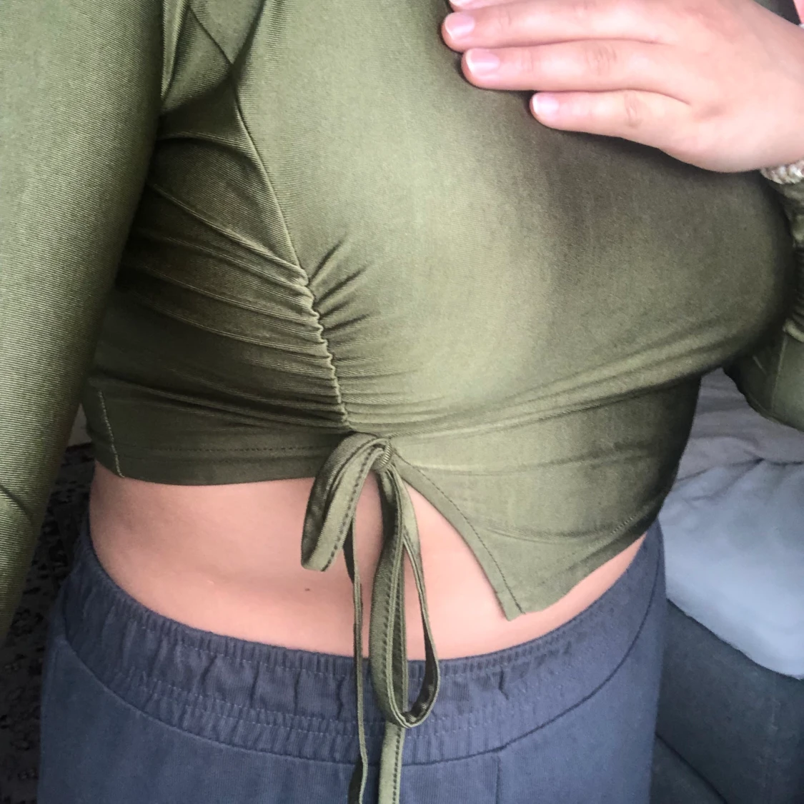 Mörkgrön top i stretchmaterial - 91