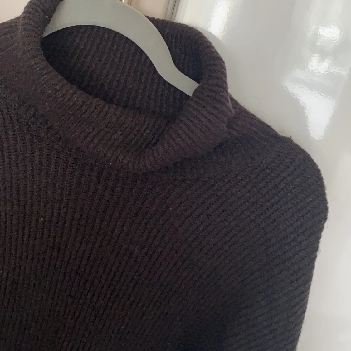 Svart stickad polo, stl M - 90