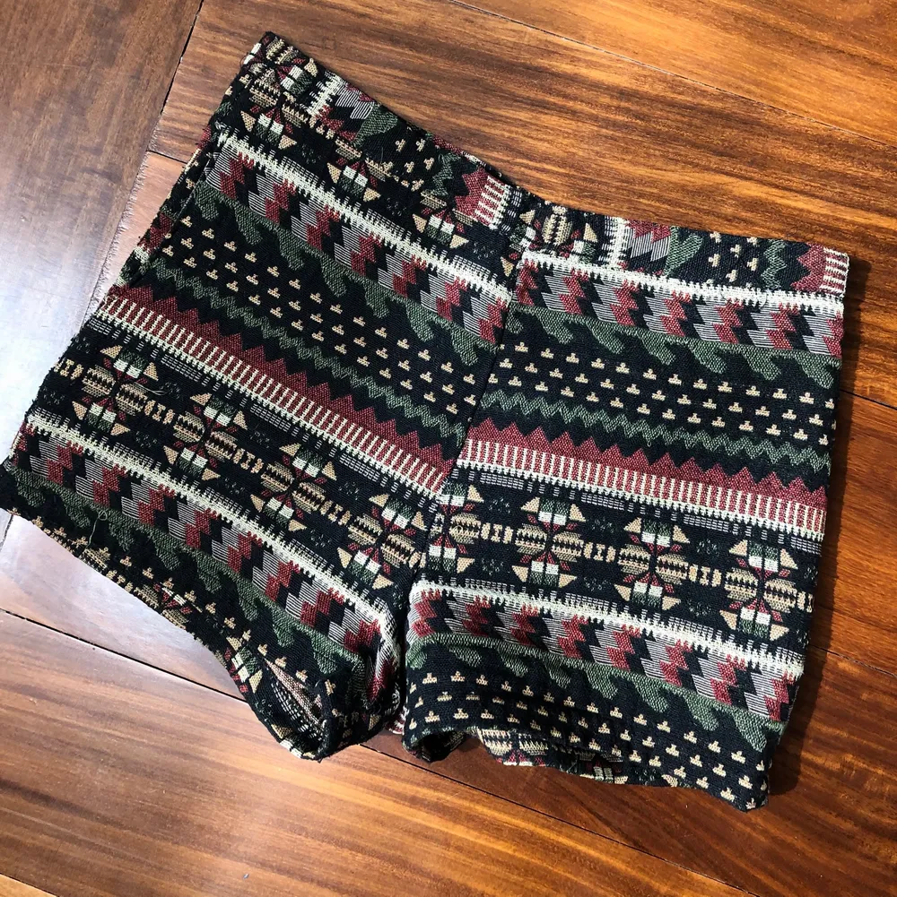 Vintage shorts from Thailand. Handwoven with exotic print. Side pocket and side zipper. Shorts.