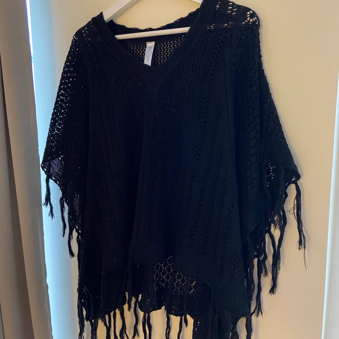 Svart poncho - 90