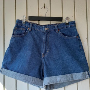 Monki denim shorts - Worn only a few times. A bit smaller than the size on the label (31). The back is longer than the front for a better fit. 100% cotton, very thick and sturdy fabric.   Waist width 40 cm Total length (front) 36 cm Total length (back) 42 cm