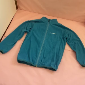 Fleece tröja  -  En blåFleece tidigare använt till ridning