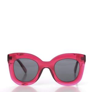 This is an authentic pair of CELINE Acetate Marta Sunglasses CL 41093/S in in Pink. These stylish sunglasses have classic chunky yet sleek translucent pink frames and dark grey tinted lenses. These are stylish sunglasses with a modern and distinctive look