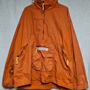 Anorak Cottonfield XL - Orange vintage anorak från Cottonfield by Carli Gry i storlek XL. Fint skick.