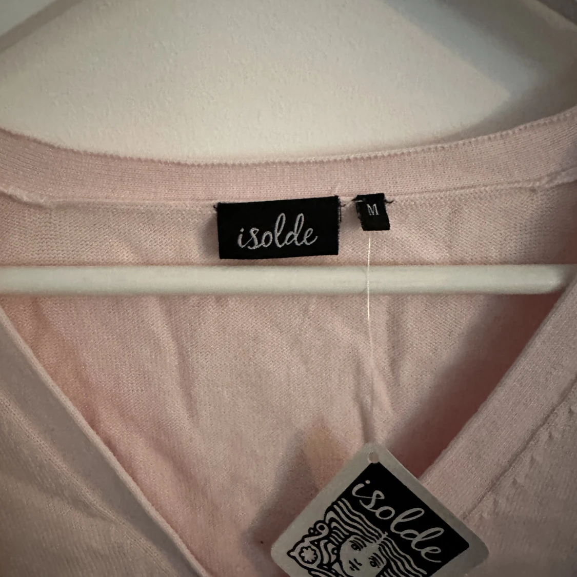 Rosa kofta med knappar - 90