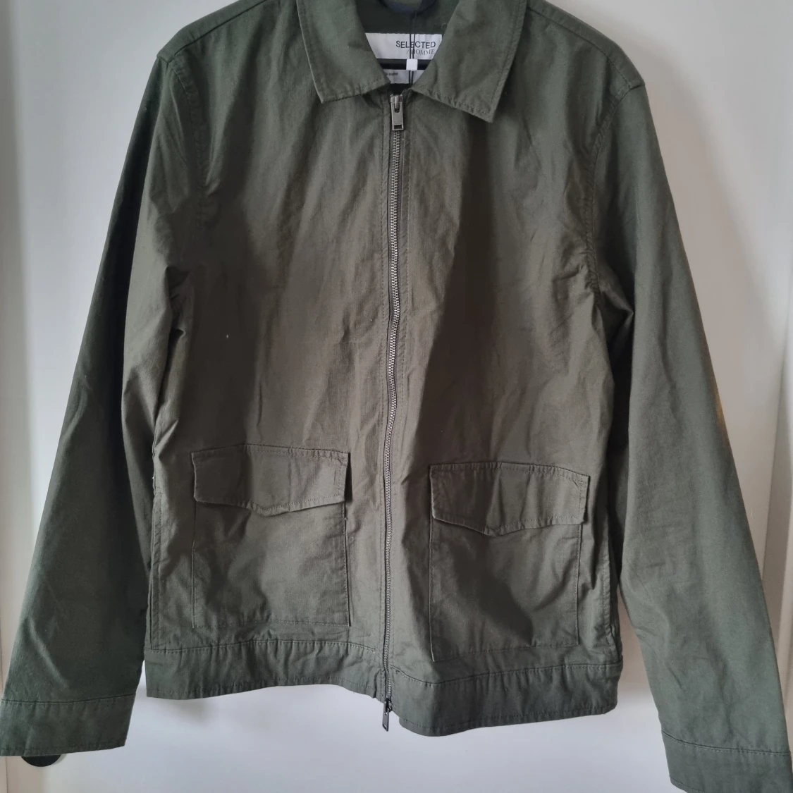 Grön jacka, oanvänd - 90